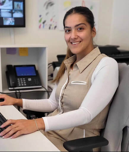 Portrait of Fatma Balik, a staff member at Burlington Family Dental, smiling in a professional setting.